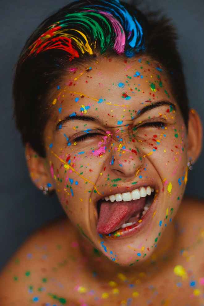 woman s face with color splatters